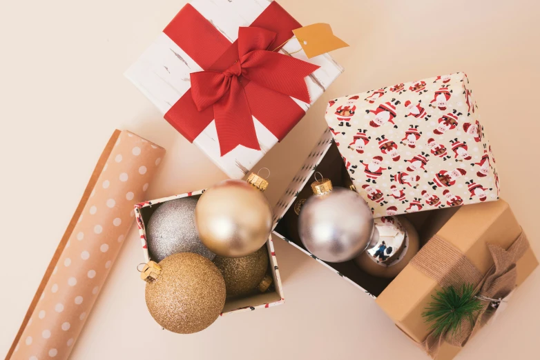 several boxes with christmas decorations and bows