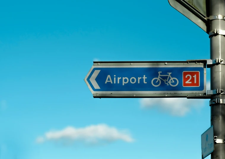 there is an airport sign showing how to get the bus or bike