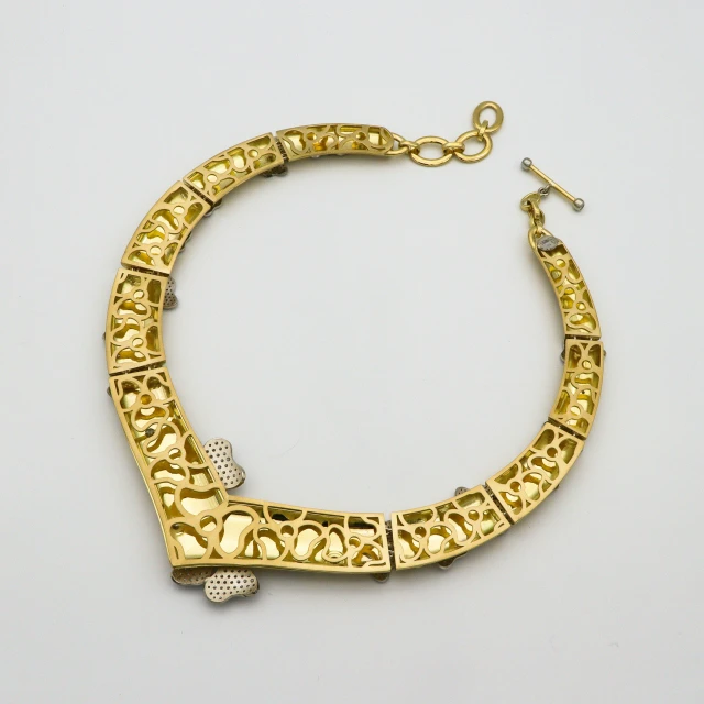 an image of a gold celet