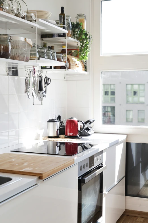 the white kitchen is clean and ready to use