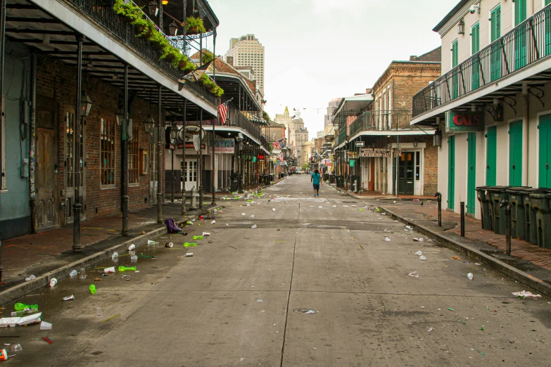 a deserted street with lots of garbage scattered around it