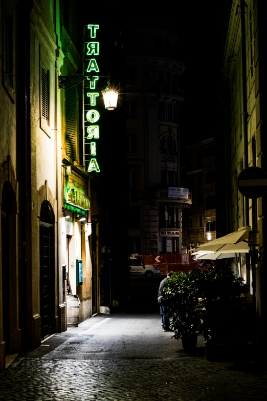 a building with neon sign on the front of it