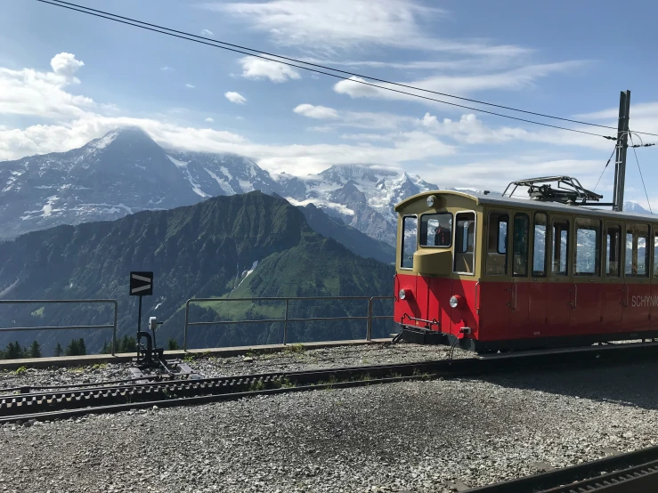 a trolly train traveling down the side of a mountain