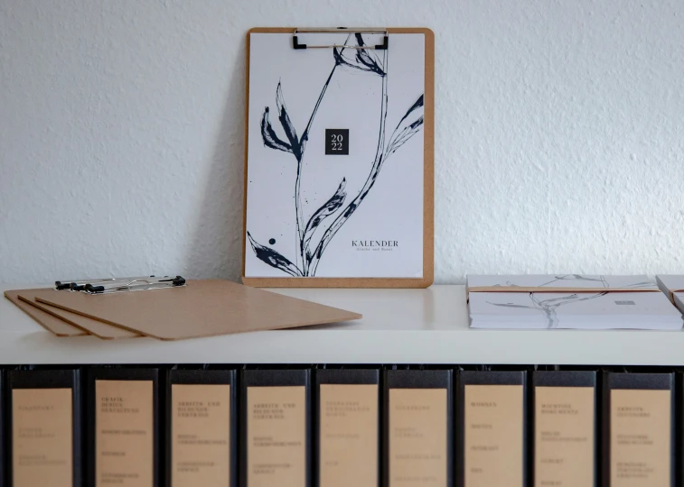 a desk with a black and white flower