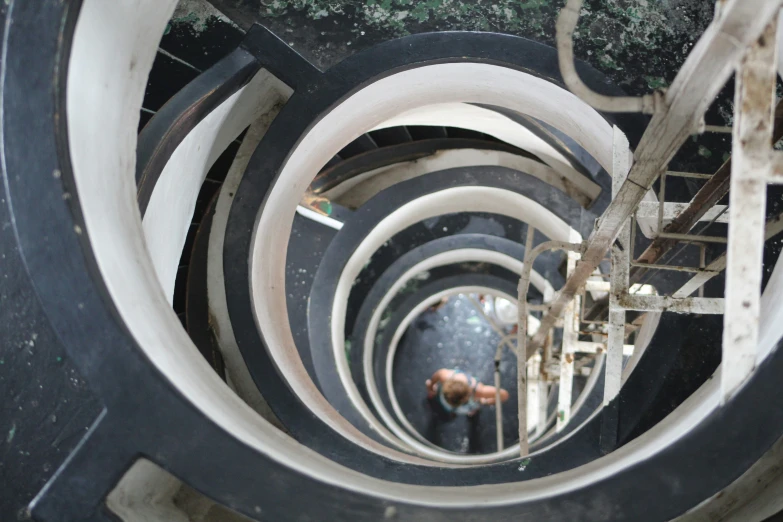 looking down into a spirally stairwell area