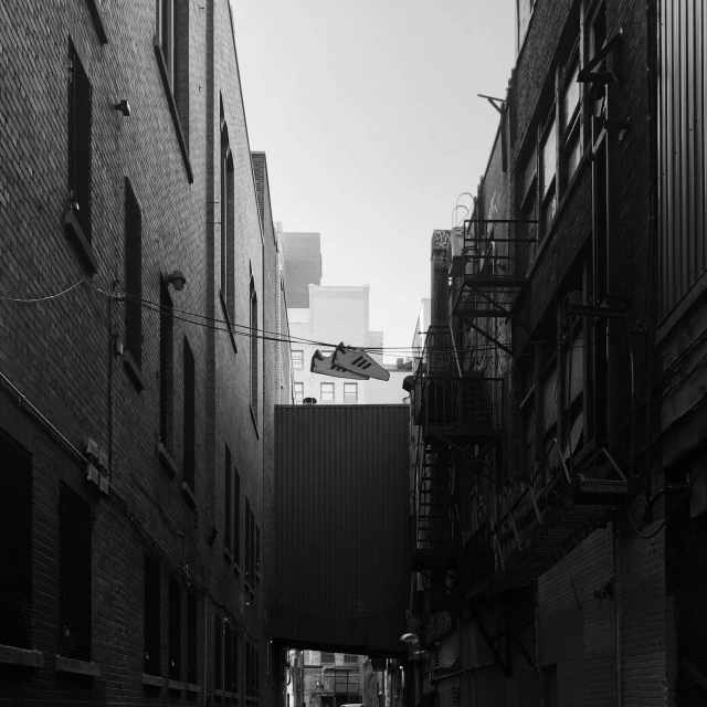 an alley that is lined with brick buildings