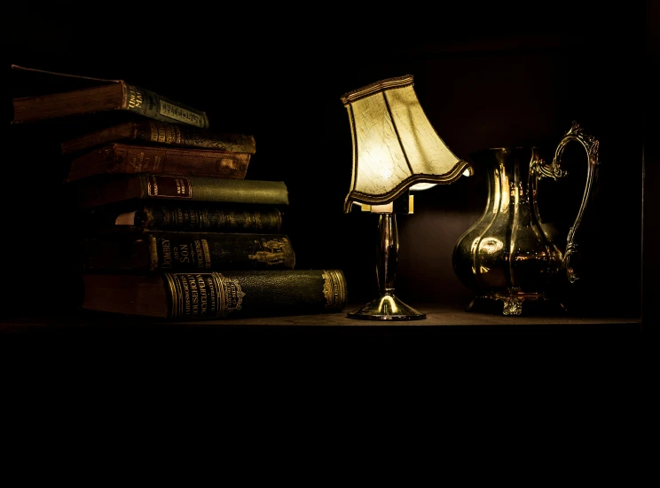 some books and a lamp on a shelf