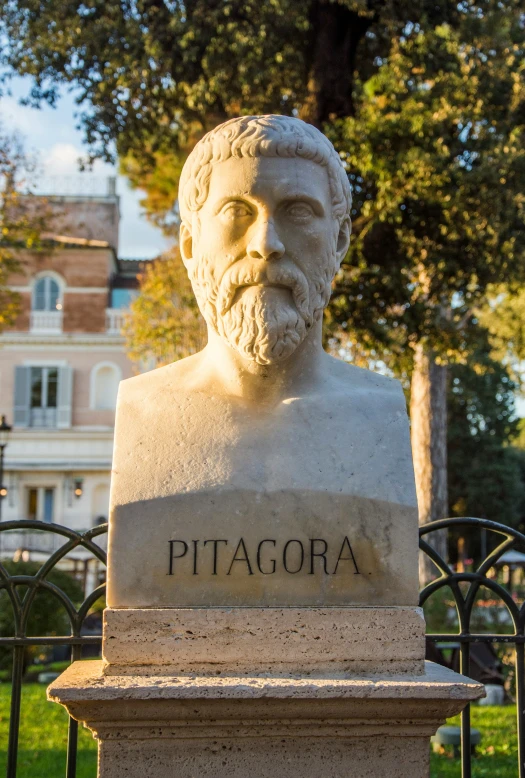 a statue of a man on the outside of a building