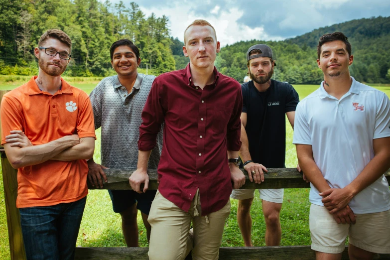 a group of men standing next to each other