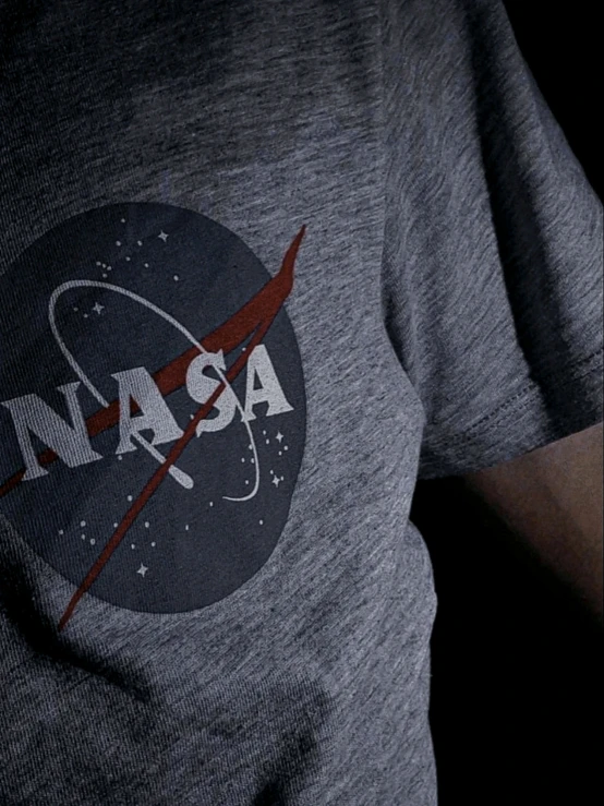 a nasa shirt with the earth and stars printed on it