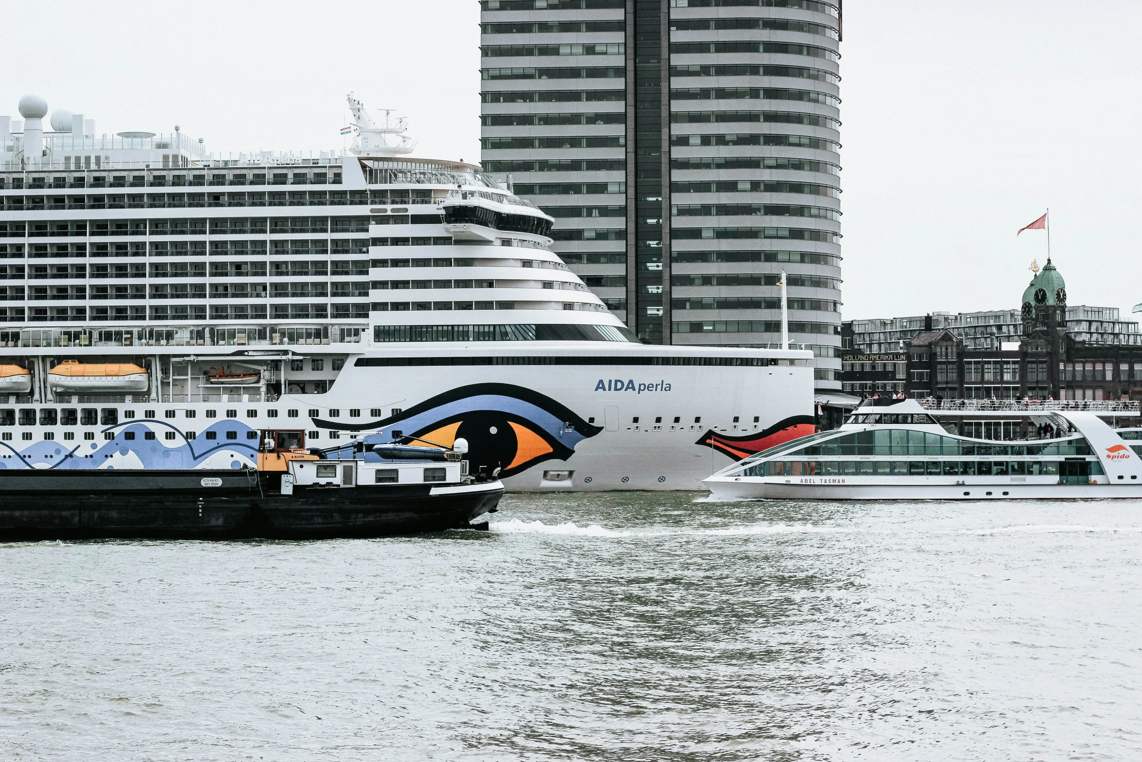 the cruise ship sits at dock in front of a building