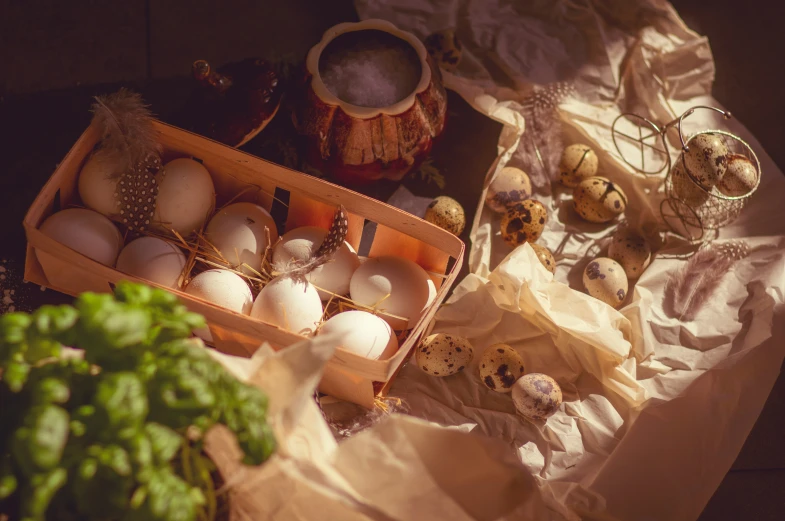 a group of eggs laying in crates sitting on a cloth