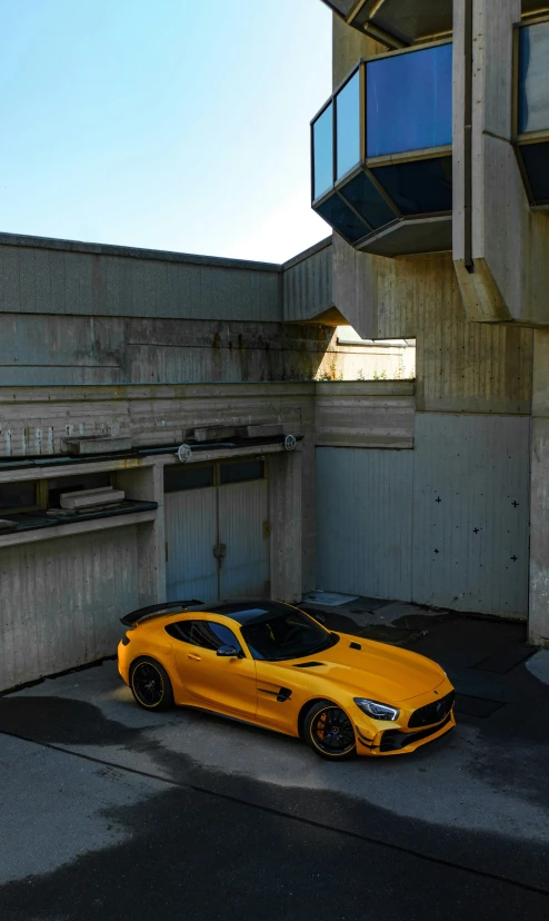 a sports car parked next to a large building