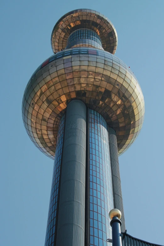 a very tall tower that is surrounded by many buildings