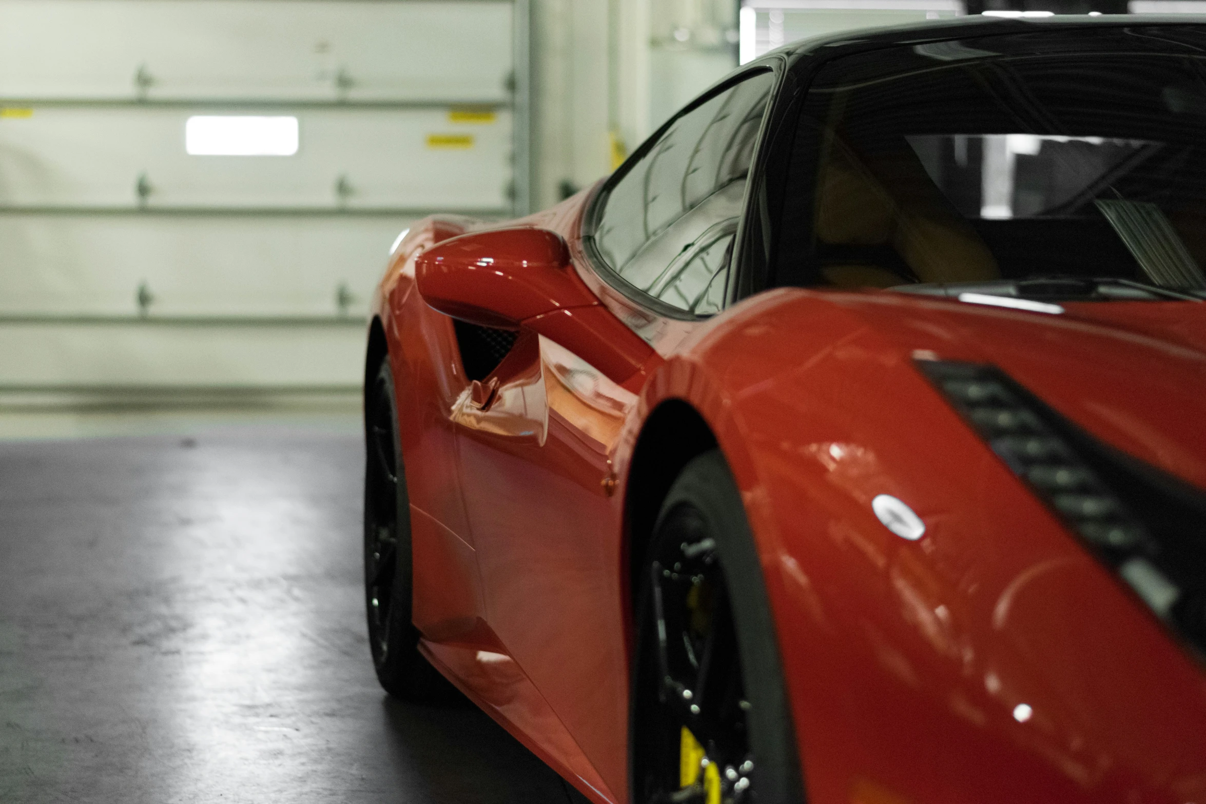 a red sports car with the front grille cut out