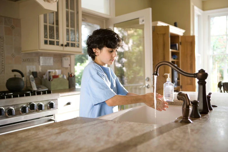 a  fixing a bottle in the sink