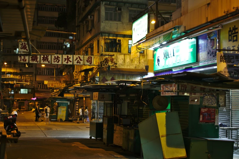 an asian street is busy with pedestrians, and stores