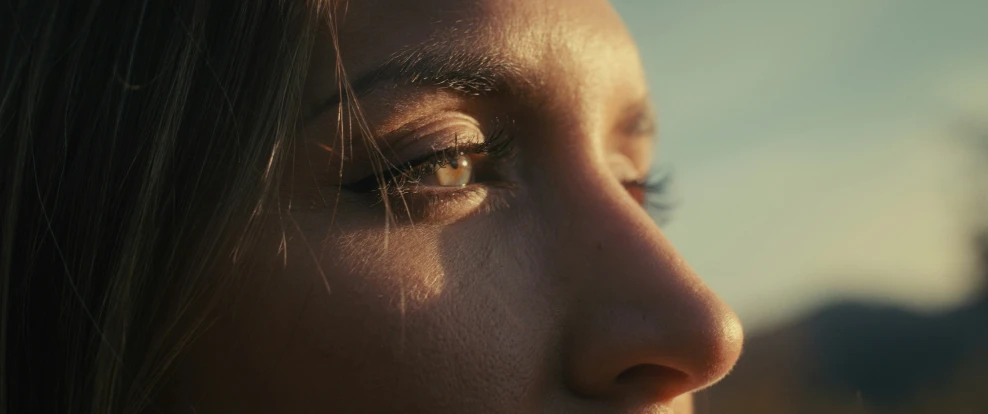 a close - up view of the face of a woman with long hair