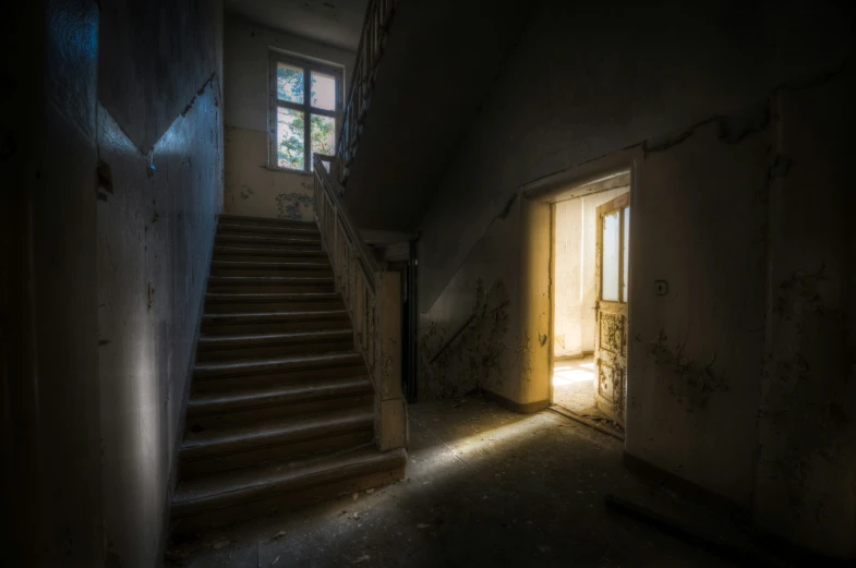 an empty stairway leading to another entrance way