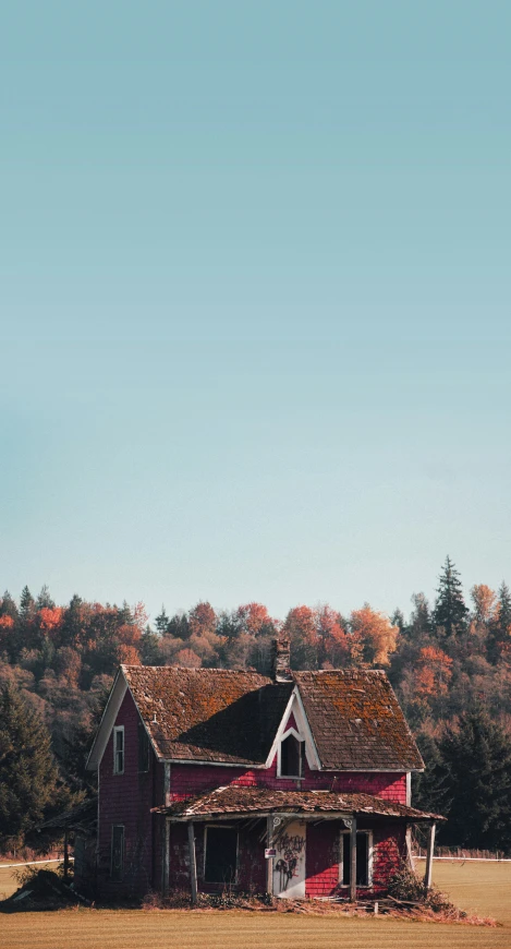 the red building is painted white and has a brown roof