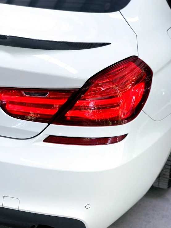 the tail light and bumper on a white car