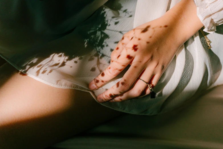 the woman is showing off her red  from an outside hand