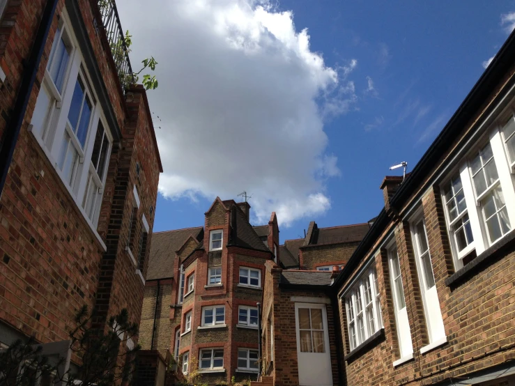 several houses on a narrow street that is under construction