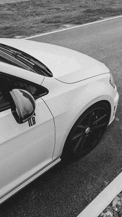 the top of a white car parked in a parking lot