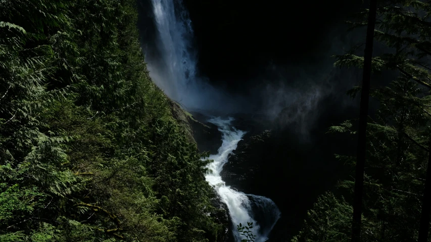 a view of the side of a waterfall from above