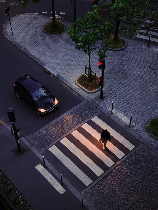 the street is empty on a rainy evening