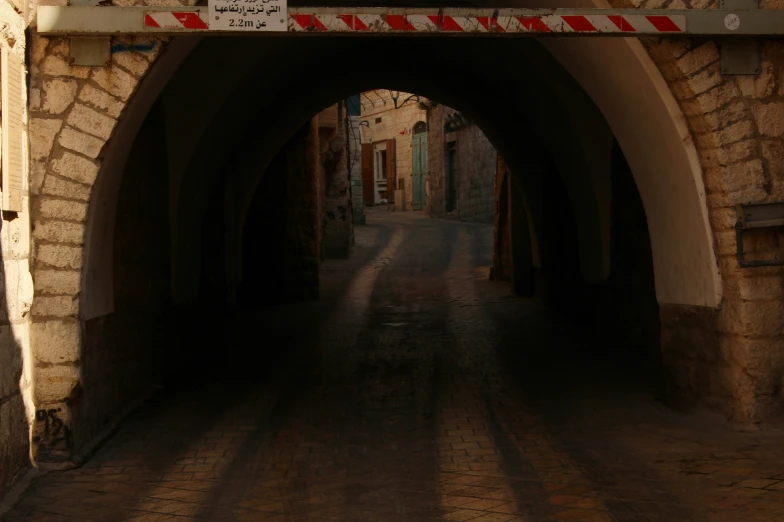 a brick arch on an old brick street