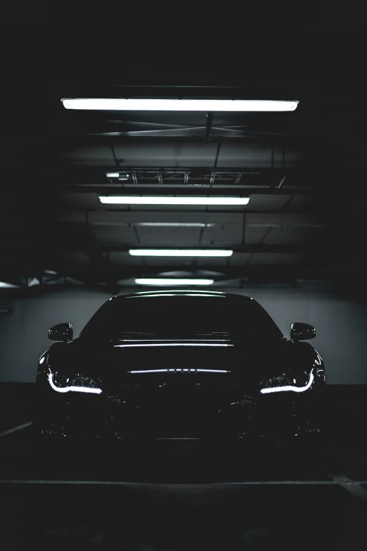 a car that is sitting under some lights