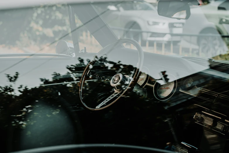 a car with the interior doors open and a steering wheel up