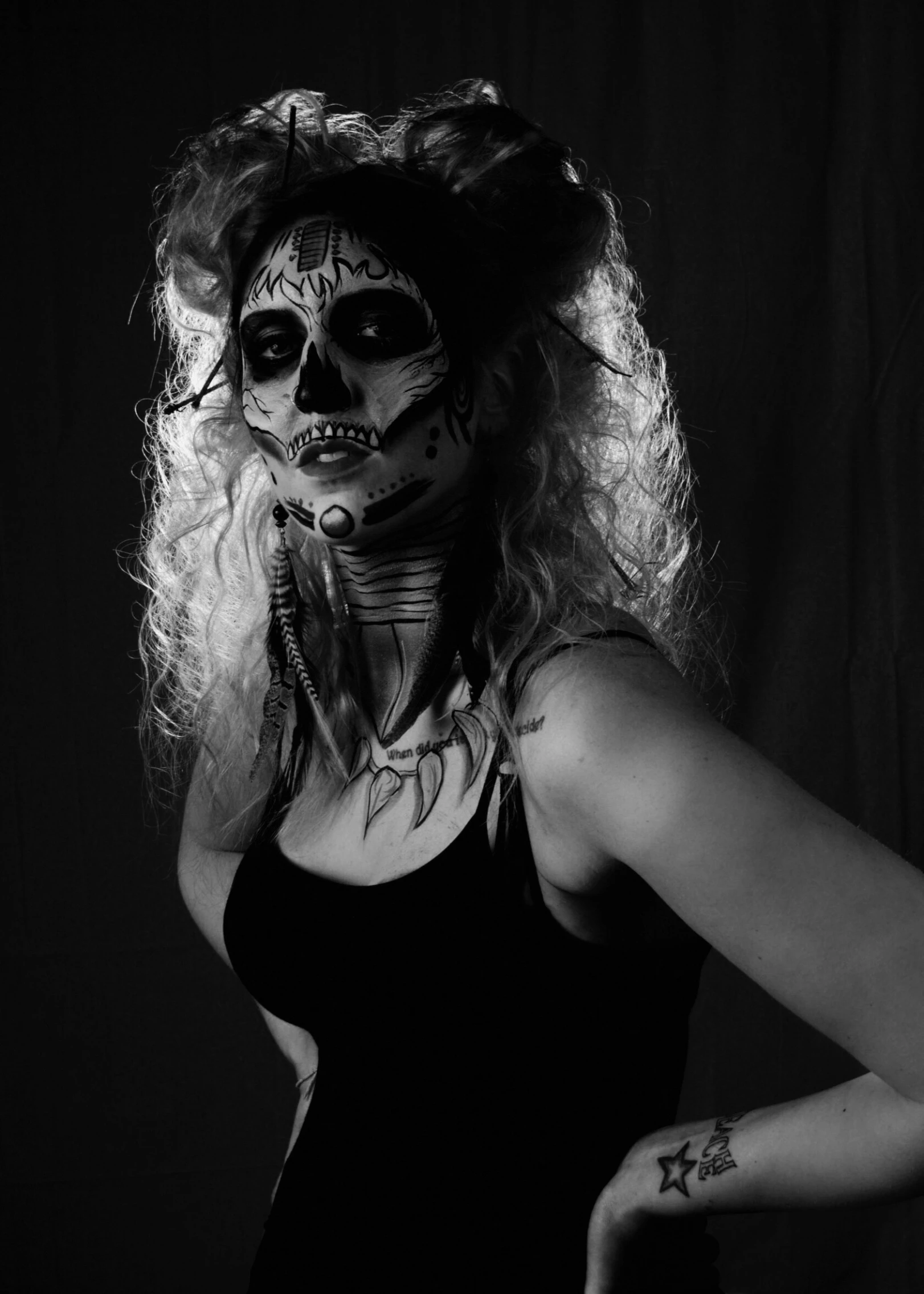 a woman with long hair and makeup in the day of the dead costume