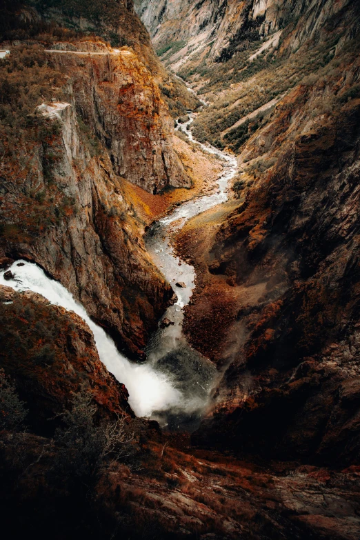 an aerial view of the gorge, flowing water and brown rock