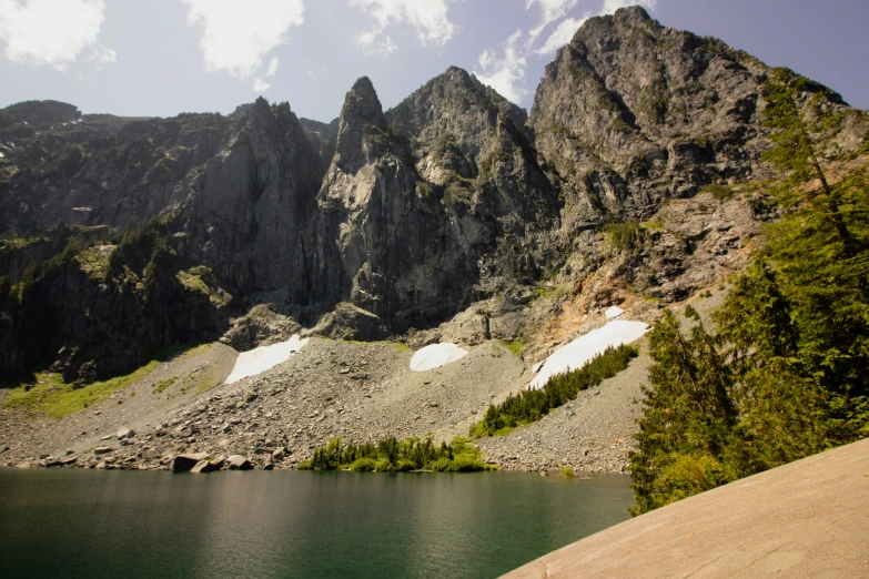 the mountains and the water are covered with white snow