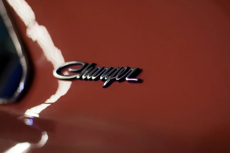 a close - up of the tail light and emblem of a classic car