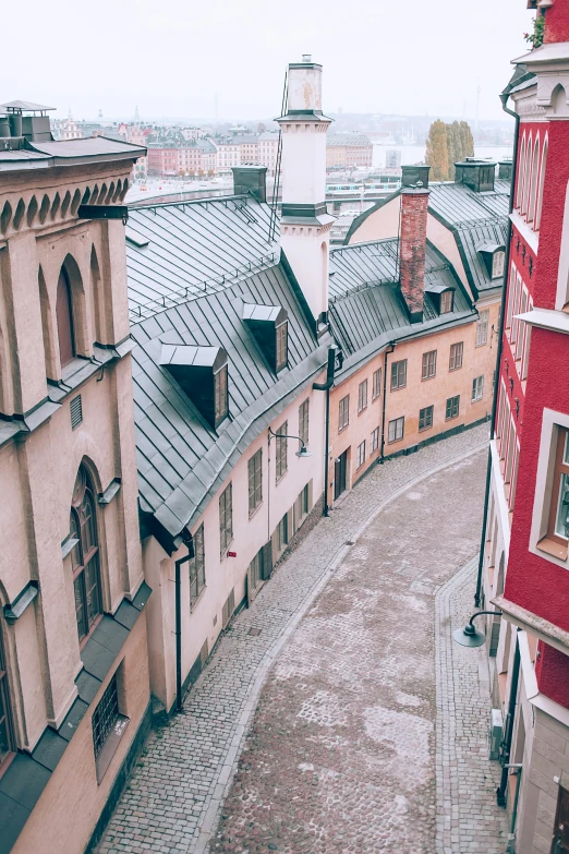 a view of buildings and a walkway in a city