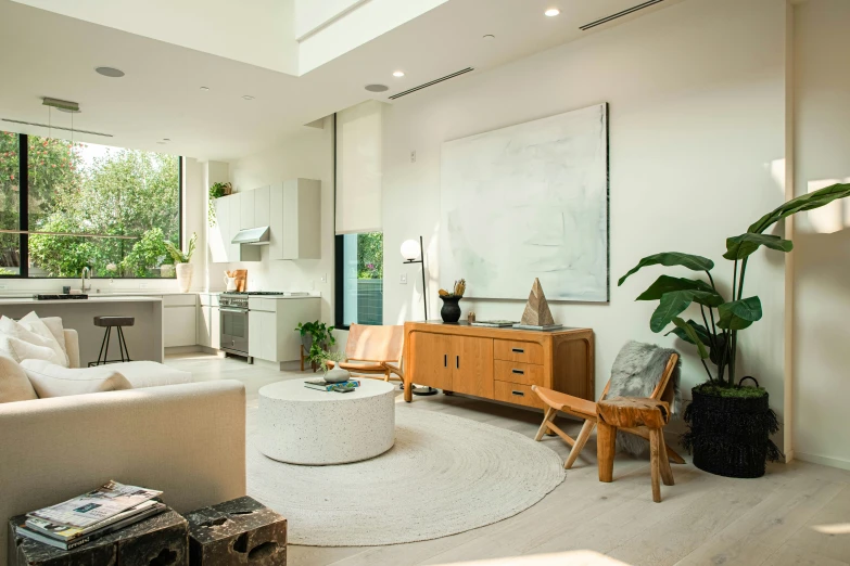 a living room filled with furniture and a large mirror