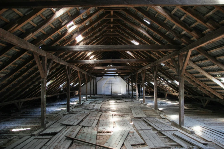 an attic is a building with no floor insulation and exposed wooden beams