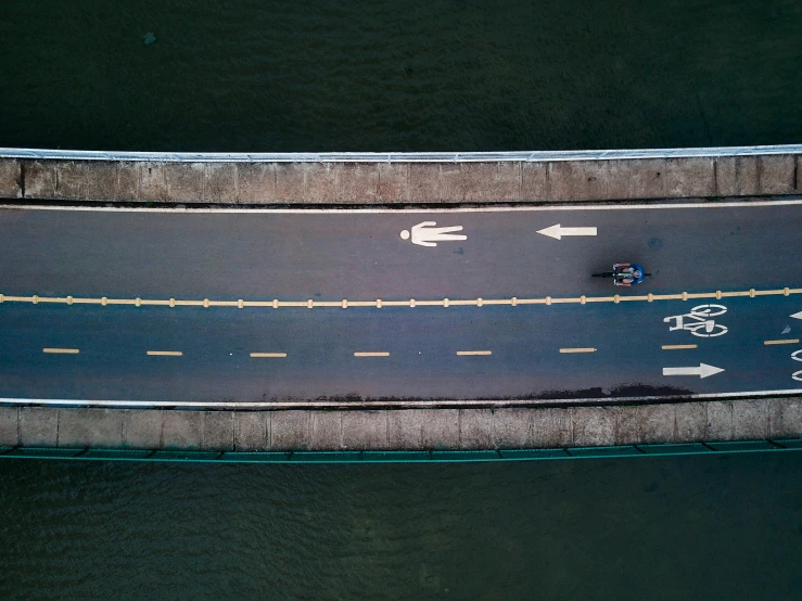 cars travelling on an intersection near the ocean