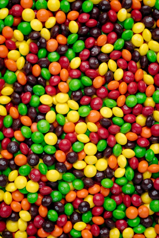 a close up of jelly beans with different colored ones