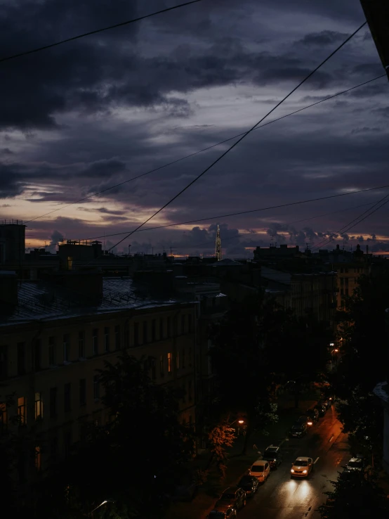 street view at night with car lights and street