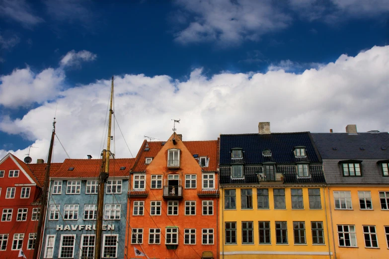 many different buildings with a sky background