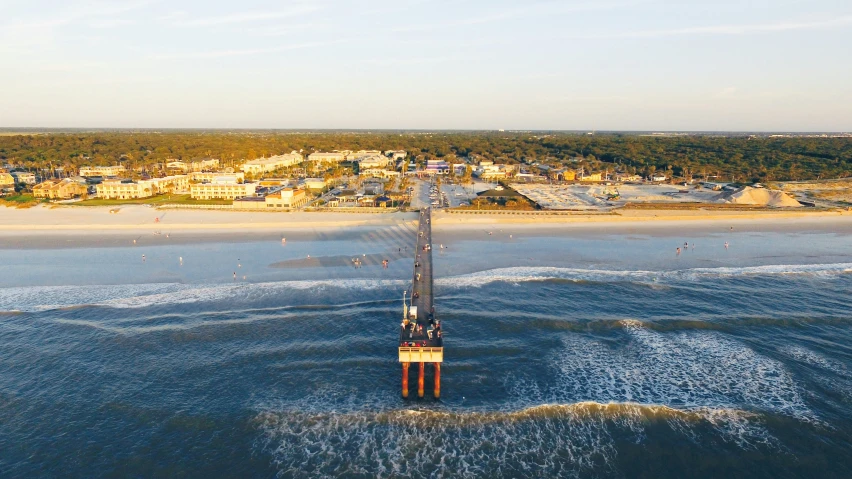 a large long tower standing in the middle of a ocean