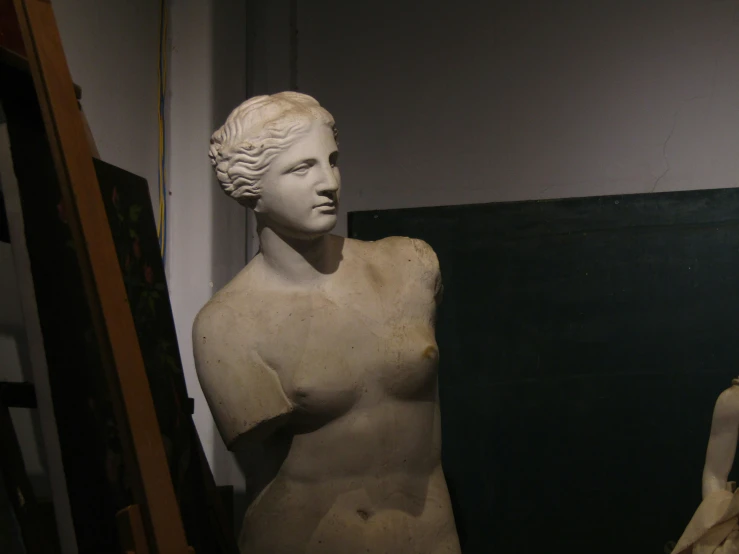 white bust of an ancient woman standing next to another