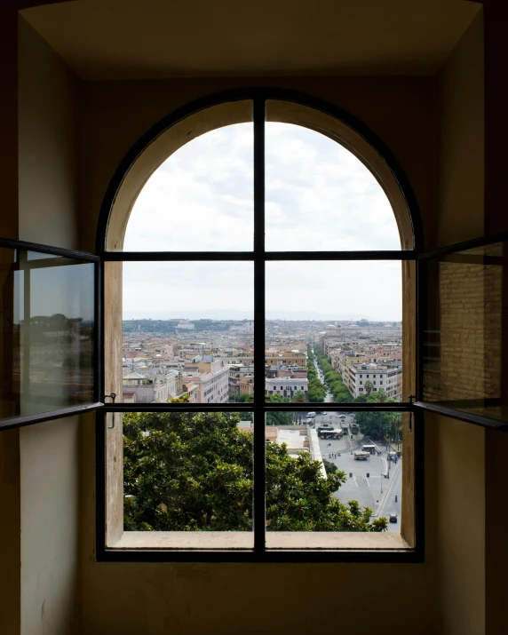 a view from a large window in a building with a view of the city