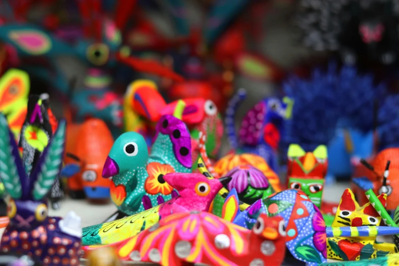 many colorful toy figurines are on display together