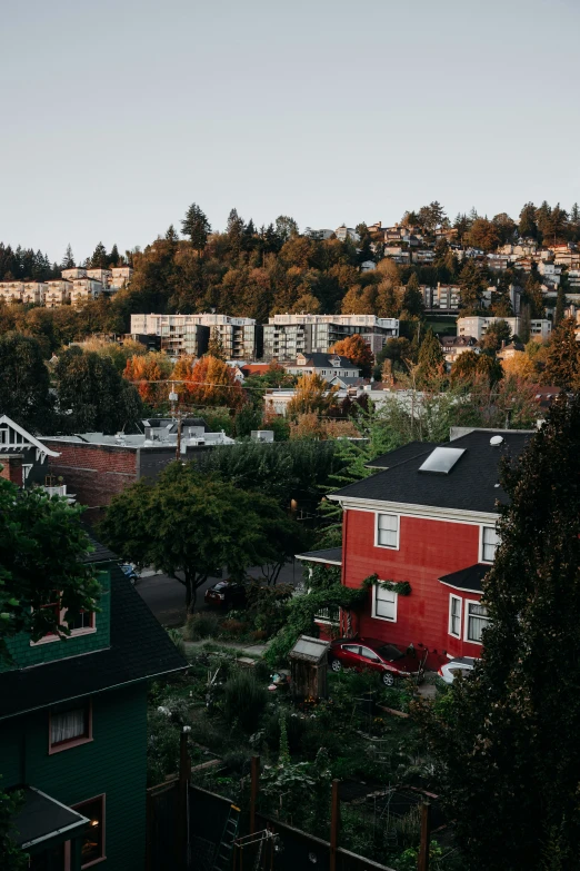 a picture of a small town with hills in the background