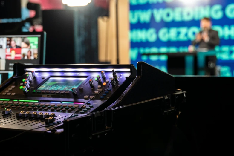 a large radio equipment set up in front of a projection screen